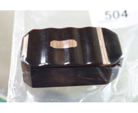 A Georgian tortoiseshell snuff box of shaped rectangular formHaving yellow metal hinge and cabochon, length 5cm (af) 