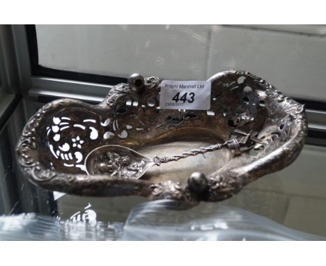 An unusual white metal spoon with windmill spinning finial together with a pierced white metal oval bowl (2).