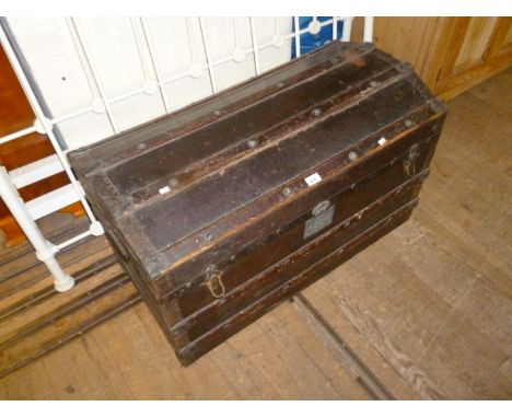 A 19th Century domed metal mounted wooden slated canvas trunk.
