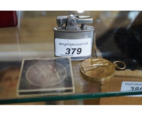 A Victorian crown dated 1893, together with a WWI medal and vintage Ronson lighter.