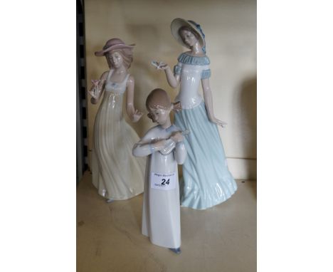 Thee Nao and Lladro figurines.