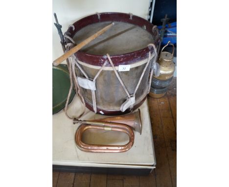 A vintage military snare drum, a copper and brass bugle also a modern brass masthead lamp.