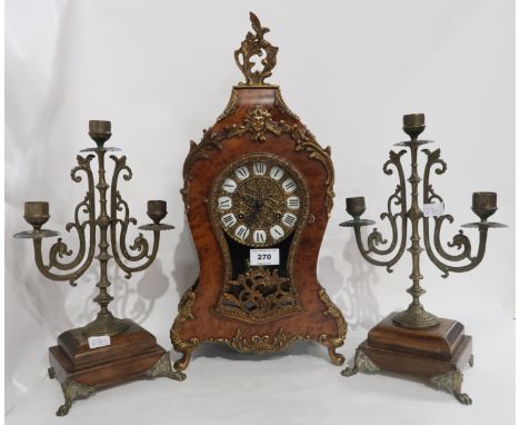 A faux wooden clock of French design, the German movement with numbers 131-070, 48cm high together with a pair of gilt metal 
