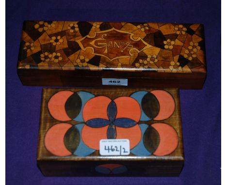A decorative wooden glove box by Gants, 28cm wide and a painted tea caddy box (2) Provenance: The Late Dr Helen. E. C. Cargil