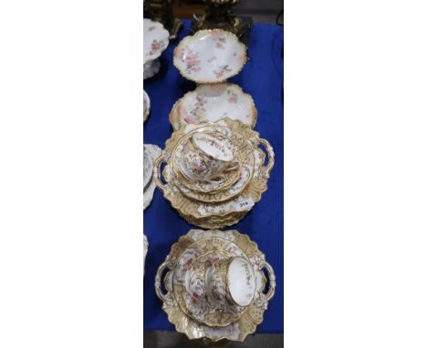 Late 19th Century English porcelain teawares, the white and beige ground painted with bouquets of flowers and gilt scrolling,