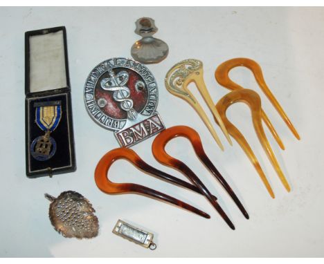 A box of miscellaneous caddy spoon, hair clasps etc Condition Report: Available upon request