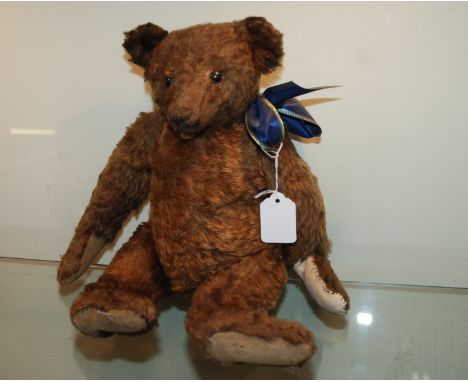 An early Teddy bear possibly a Steiff example, 38cm high Condition Report: Available upon request