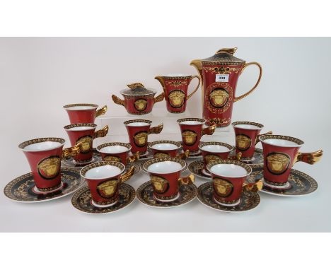 A Rosenthal Versace Medusa coffee set in orange and black colourway, comprising coffee pot, milk jug, lidded sugar pot, open 