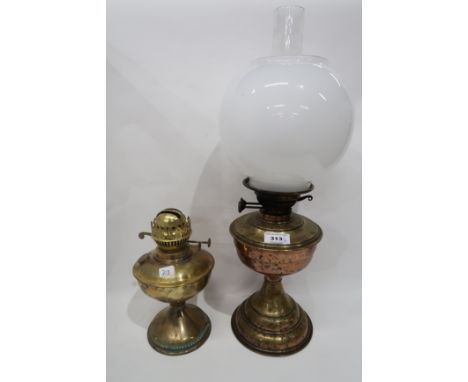 A brass oil lamp and another lamp Condition Report: Available upon request