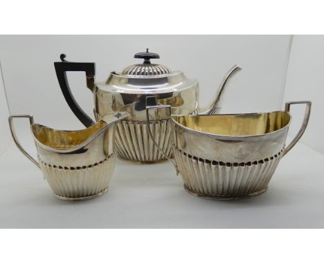 A three piece silver tea service, Birmingham 1896 and 1897, 916gms Condition Report: Not available for this lot