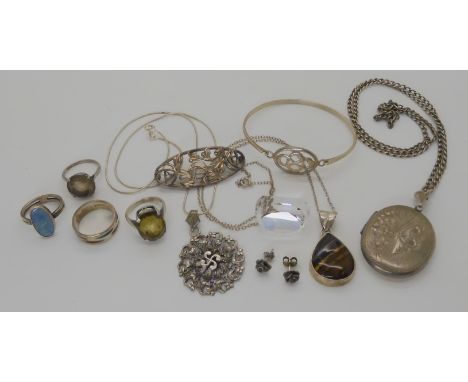 An Irish silver and enamel ring, a large rock crystal fob stone, a silver tiger's eye pendant and chain and other items Condi