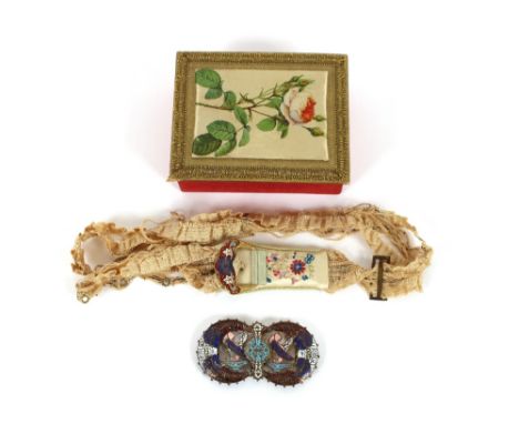 An Antique dress belt, with embroidered decoration and enamel buckle; and a two piece enamel belt buckle etc.