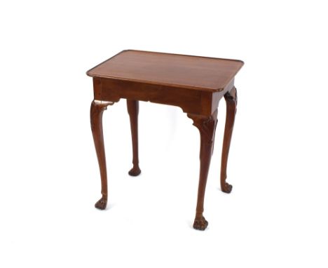 A 19th Century&nbsp;walnut side table,&nbsp;the shallow tray top raised on shell shoulders and cabriole supports terminating 