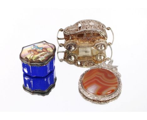 A small enamel patch box, the lid decorated with a figure galloping on horseback; a miniature filigree work model of a car an