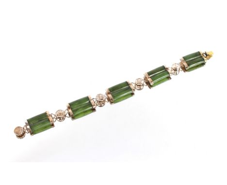 A gilt metal and jade bracelet