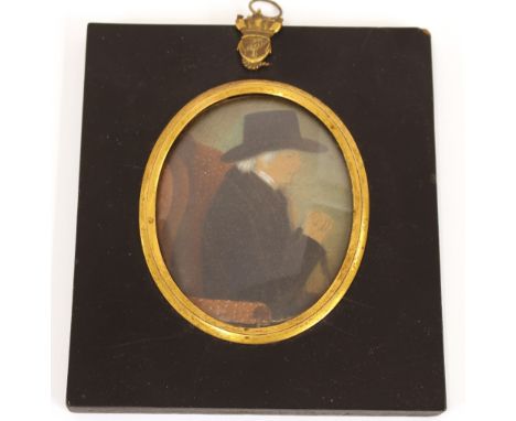 A 19th Century miniature portrait, of a gentleman in black coat and hat, contained in an ebonised and brass mounted frame wit