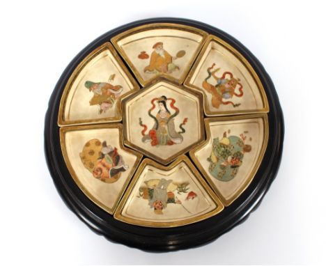 An early 20th Century Satsuma pottery suite of 7 sweetmeat dishes, by Gyokozan, each decorated with a god of happiness, the c