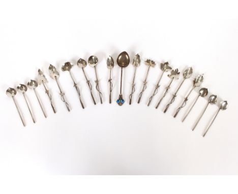 A collection of Continental white metal and silver teaspoons, fancy spoons etc., one with Art Nouveau enamel decoration