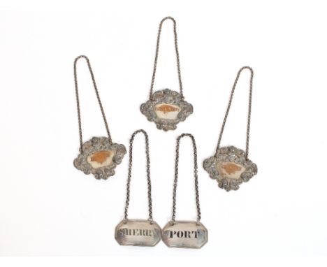 A pair of George III silver decanter labels, Edinburgh 1817, "Port" and "Sherry"; and three Sheffield plated decanter labels