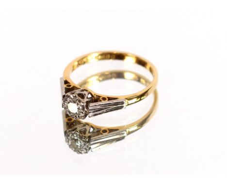 An 18 carat gold and diamond set ring