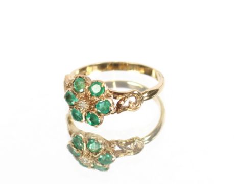 A 9 carat gold emerald and diamond cluster ring