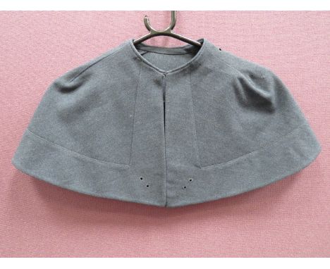 Scarce RAF PMRAFNS Officer’s Capeblue grey, melton cloth, short shoulder cape.  The rear panel with central rosette.  Shoulde