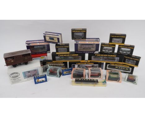 Quantity of Model Railway Rolling Stock etc.A selection of various scale, most complete with boxes. ... plus miniature cars e