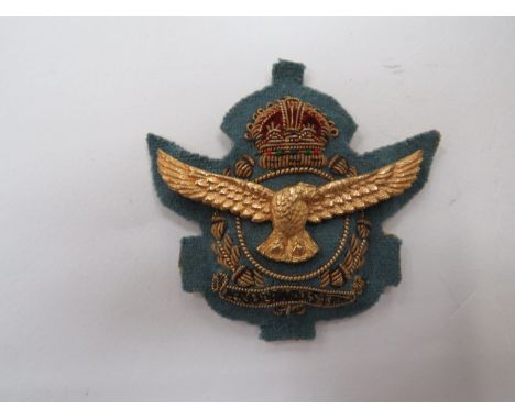 South African Air Force rare pre 1953 staff Officer’s cap badge.A fine light blue felt embroidered with bullion crowned spray
