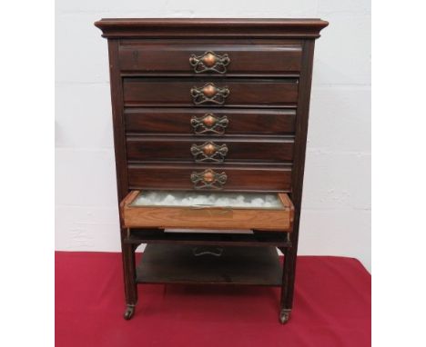 Edwardian Mahogany Collecters Set of Drawers.This example is made with six narrow drawers, each with a clear glass top. Raise