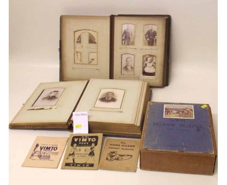 Two photograph albums c.1900 and a wooden jigsaw GWR 400 pieces in original box also home guard pocket manual. Condition repo