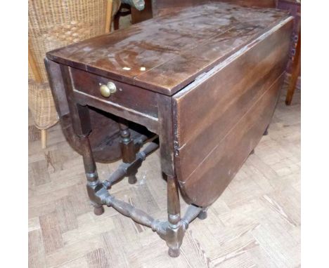 George III oak gate-leg table on turned legs with single end drawer. Condition report: see terms and conditions
