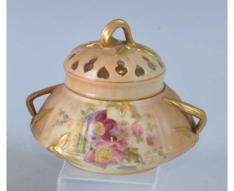 An Edwardian Royal Worcester porcelain blush ivory twin handled pot pourri jar and cover, of squat bulbous form, decorated wi