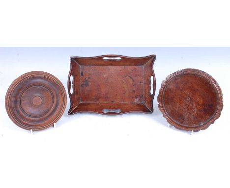 * An early 19th century small mahogany tray, of shaped rectangular form, having fret-carved handles, 16 x 24cm; together with