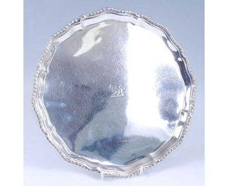 A George V silver salver, of shaped circular form with a gadrooned rim, the centre engraved with a lion passant, the whole st