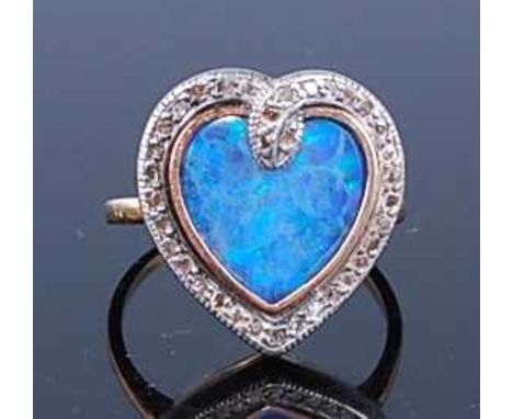 A yellow and white metal, composite opal and diamond dress ring, the heart shaped opal doublet within a snake border set with