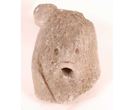 An architectural limestone block / gargoyle, carved as a "Green Man" type face, probably Medieval, w.31, d.25, h.37cm.