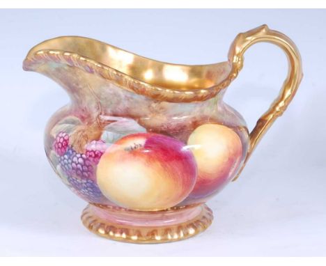 A Royal Worcester porcelain cream jug, decorated with fruit on a mossy bank by J Skerrett, signed, within gadrooned gilded bo