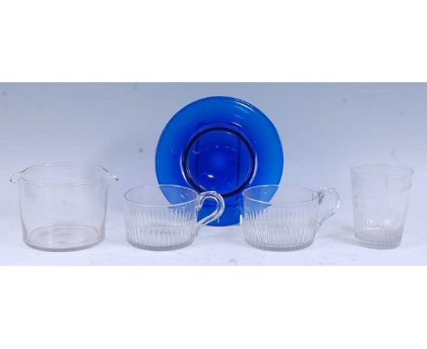 * A Regency glass rinser, flanked by twin lips, 9cm high, together with a circa 1800 glass tumbler, engraved with a fluted bo