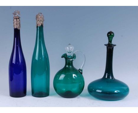 * A 19th century green glass decanter, the slender neck above a squat globular form body, 29cm high (including stopper), toge