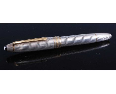 A Mont Blanc silver cased Meisterstuck No.146 fountain pen, with gilt metal clip and banding, numbered EB10 1616, having 18ct