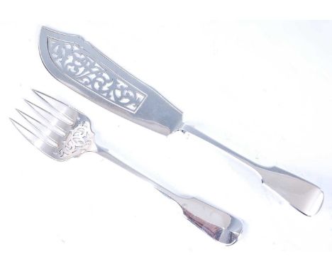 A large Victorian silver fish slice, in the Fiddle pattern, the shaped blade with pierced decoration, together with the match