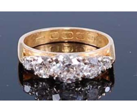 A 22ct yellow gold diamond half hoop eternity ring, featuring five graduated Old European cut diamonds in claw settings, diam