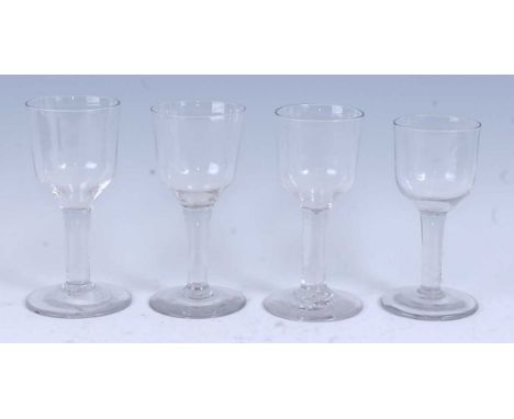 * A matched set of four circa 1760 wine glasses, the ogee bowls above a plain straight stem and standing upon a folded foot, 