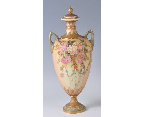 An Edwardian Royal Worcester porcelain blush ivory twin handled pedestal vase and cover, of tapering amphora form to a slende