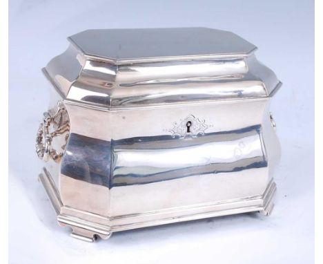 A late Victorian Britannia silver tea caddy, of shaped sarcophagus form in the Baroque style, with hinged cover, locking mech