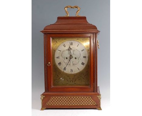 A 19th century mahogany cased bracket clock, having an unsigned silvered dial with Roman numerals and outer scale with Arabic