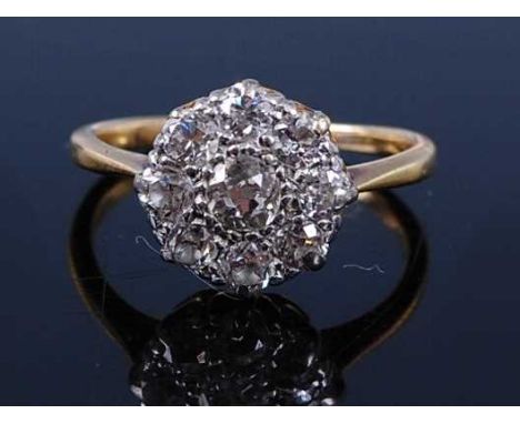 A yellow and white metal diamond circular cluster ring, comprising nine Old European cut diamonds in claw settings, diamond d