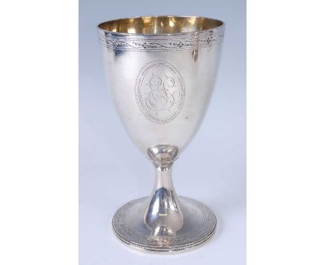 * A George III silver pedestal wine goblet, having gilt-washed interior, bright cut engraved banded rim, and bordered monogra