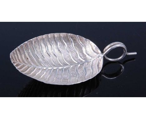 A George III silver caddy spoon, the bowl in the form of a leaf with tendril handle, maker probably Joseph Taylor, Birmingham