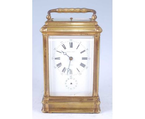 Henry Capt of Geneva - a late 19th century brass grand-sonnerie carriage clock, with leather outer travel case, being gorge c